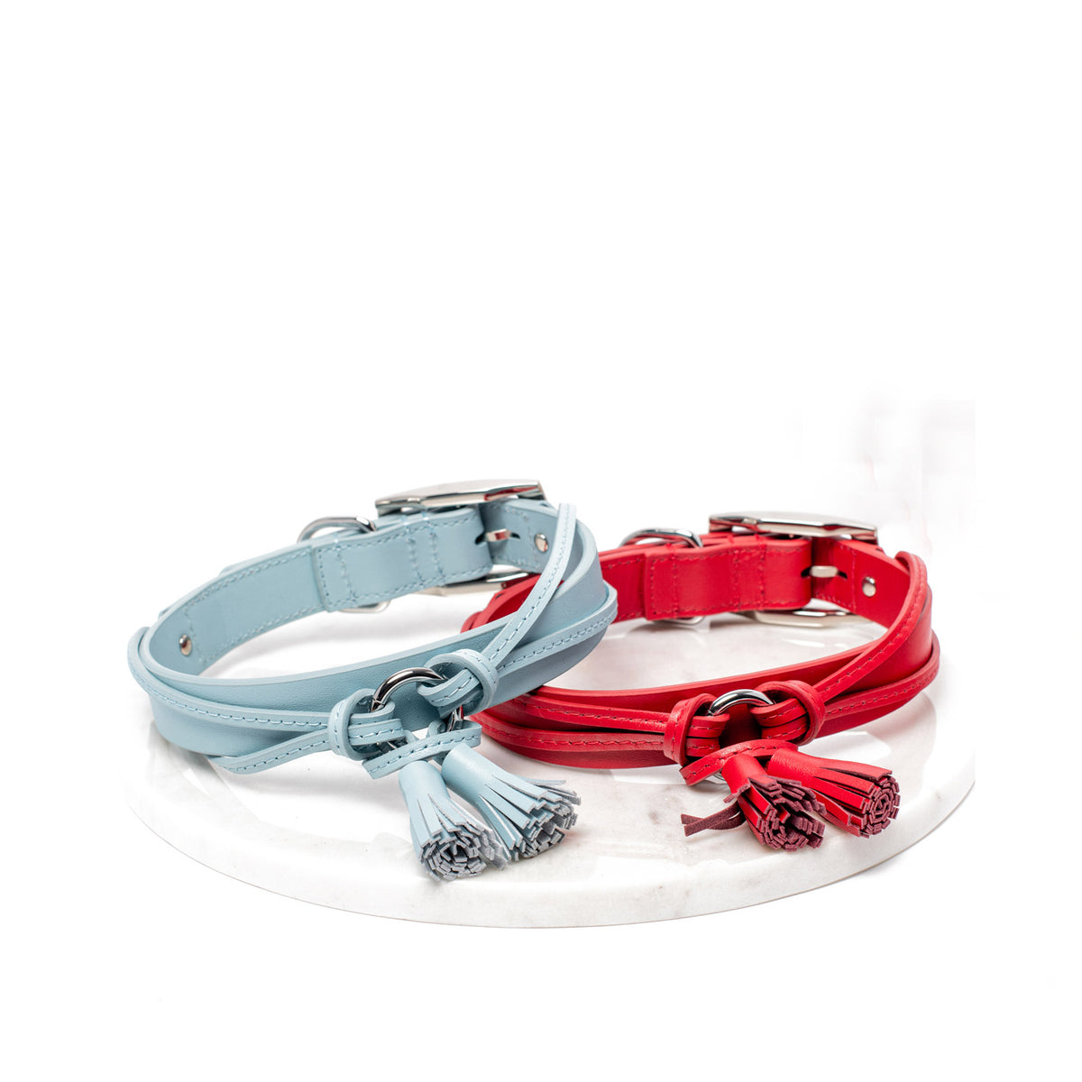 Rufus & Coco's Paris light blue leather dog collar is made from 100% quality leather. Each collar is finished with light blue stitching, matching leather tassles and premium silver hardware for style and durability. This fashionable light blue leather dog collar is available in 4 sizes.