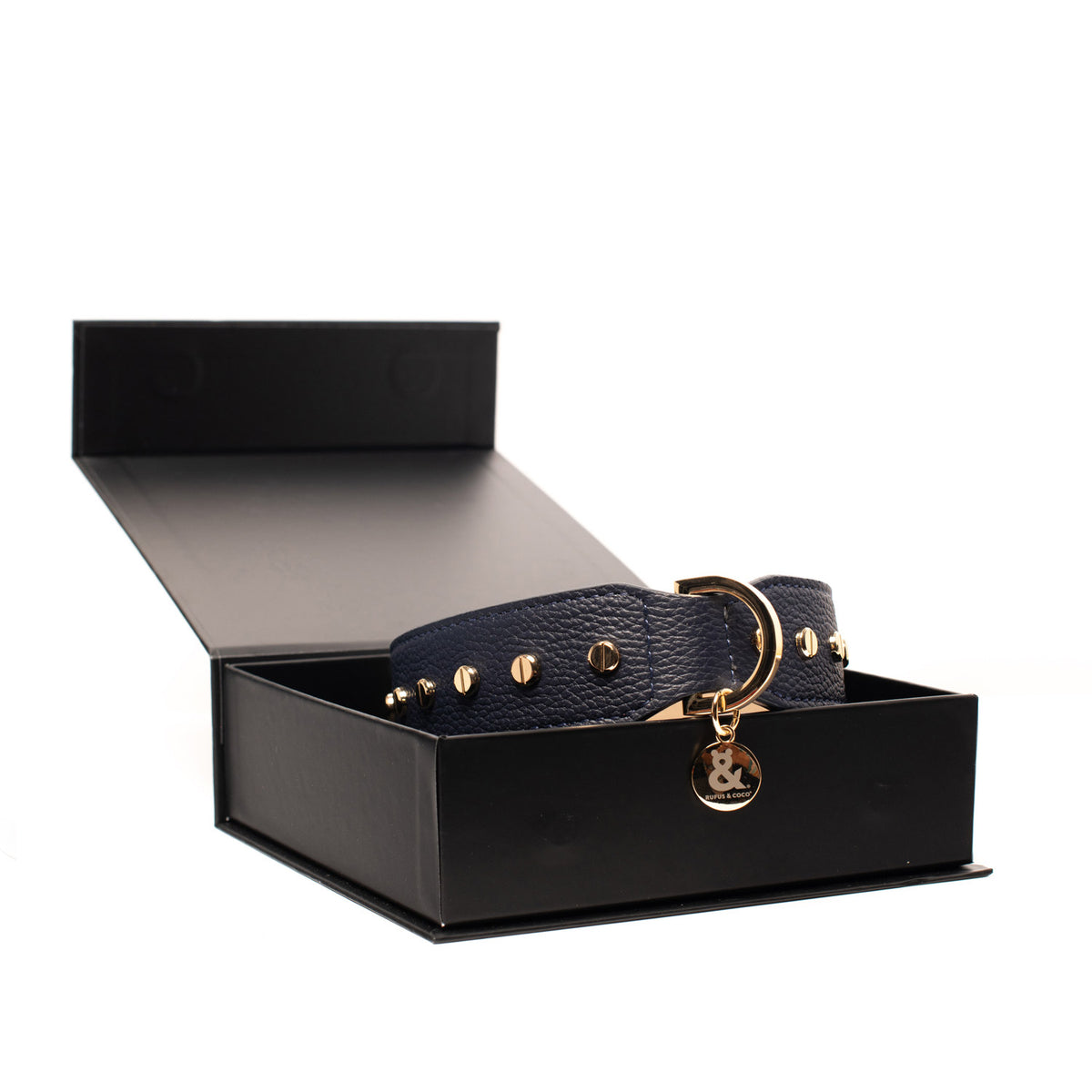 Rufus & Coco's Berlin Navy leather dog collar is made from 100% quality leather. Each collar is finished with premium gold hardware and studs for style and durability. The Navy leather dog collar is available in 4 sizes.