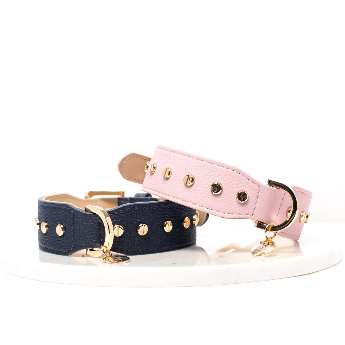 Rufus & Coco's Berlin Navy leather dog collar is made from 100% quality leather. Each collar is finished with premium gold hardware and studs for style and durability. The Navy leather dog collar is available in 4 sizes.