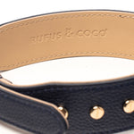 Rufus & Coco's Berlin Navy leather dog collar is made from 100% quality leather. Each collar is finished with premium gold hardware and studs for style and durability. The Navy leather dog collar is available in 4 sizes.