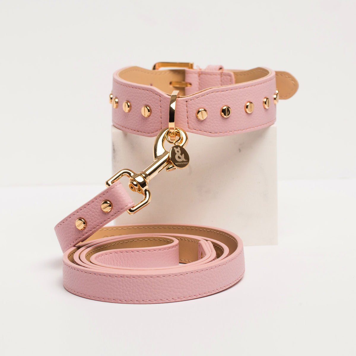 Rufus & Coco's Berlin Rose leather dog collar is made from 100% quality leather. Each collar is finished with premium gold hardware and studs for style and durability. The Rose leather dog collar is available in 4 sizes.