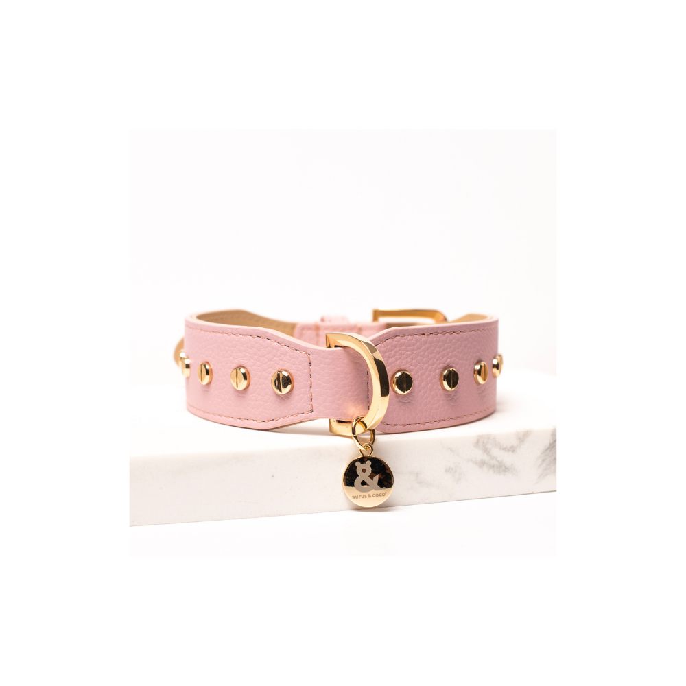 Rufus & Coco's Berlin Rose leather dog collar is made from 100% quality leather. Each collar is finished with premium gold hardware and studs for style and durability. The Rose leather dog collar is available in 4 sizes.