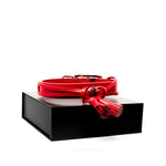 Rufus & Coco's Paris red leather dog collar is made from 100% quality leather. Each collar is finished with red stitching, matching leather tassels and premium silver hardware for style and durability. This fashionable red leather dog collar is available in 4 sizes.